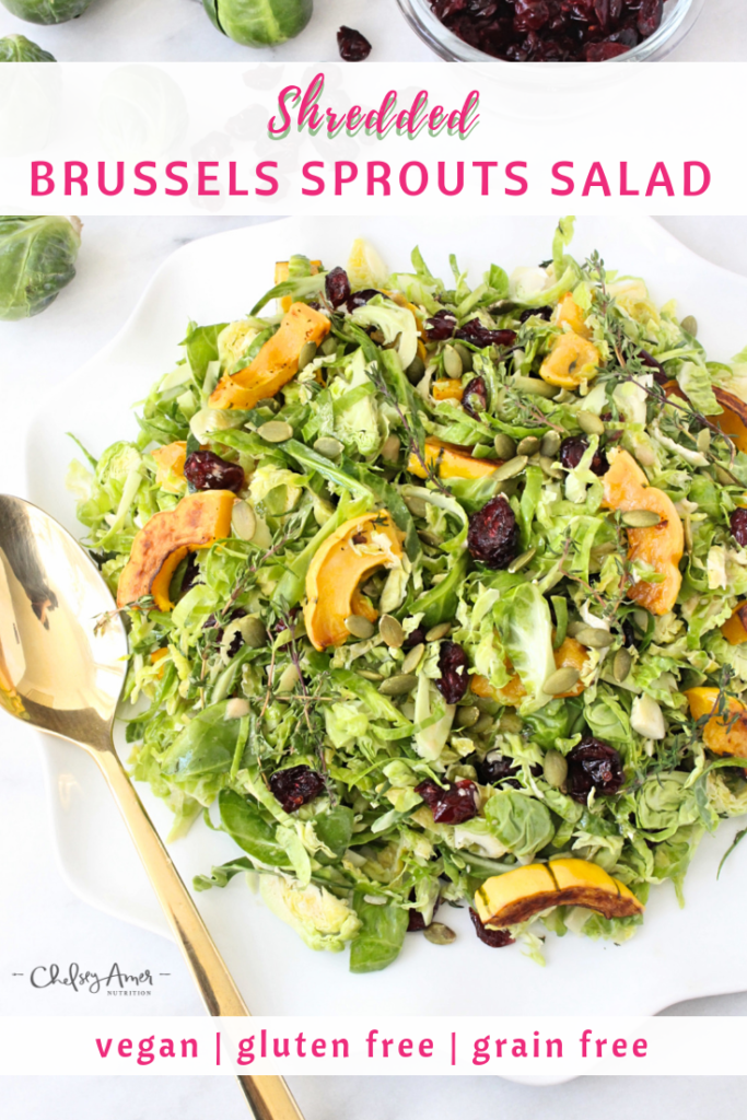 Shredded Brussels Sprouts Salad | Chelsey Amer Nutrition A hearty combination of sweet and tangy flavors — Brussels sprouts, cranberries, and delicata squash — dressed with honey dijon mustard vinaigrette, finds the perfect home at your Thanksgiving table! Vegan, Gluten Free, Grain Free