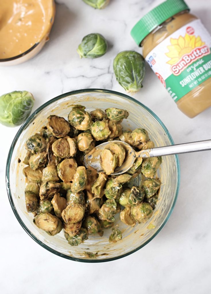 Crispy SunButter Brussels Sprouts (Plus My #1 Tip For Navigating the Holidays With Food Allergies) | Chelsey Amer Nutrition Move over boring Brussels sprouts! These nut-free Crispy SunButter Brussels Sprouts are smothered in a slightly spicy sunflower seed butter sauce and decorated with dried cranberries - a delicious addition to your holiday table. Nut Free, Dairy Free, Gluten Free, Soy Free, Vegan
