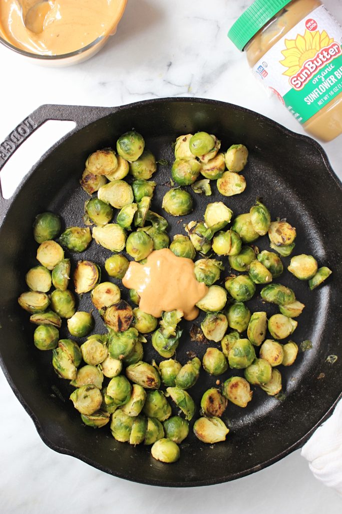 Crispy SunButter Brussels Sprouts (Plus My #1 Tip For Navigating the Holidays With Food Allergies) | Chelsey Amer Nutrition Move over boring Brussels sprouts! These nut-free Crispy SunButter Brussels Sprouts are smothered in a slightly spicy sunflower seed butter sauce and decorated with dried cranberries - a delicious addition to your holiday table. Nut Free, Dairy Free, Gluten Free, Soy Free, Vegan