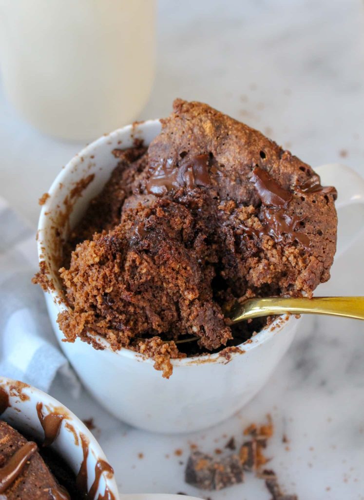 Healthy Chocolate Mug Cake with bite out of it