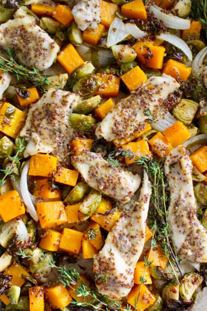 with fall flavor — this Sheet Pan Maple Dijon Chicken with Butternut Squash and Brussels Sprouts