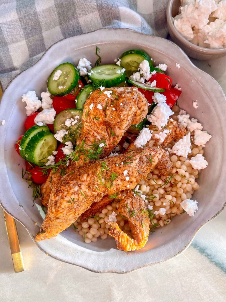 Healthy Chicken Shawarma Bowls are made with tender spiced chicken, atop pearled couscous, with fresh veggies for a flavorful balanced dinner perfect for busy weeknights and meal prep.